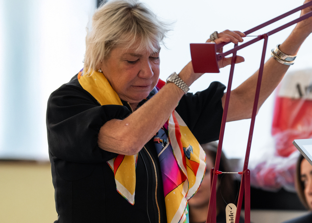 Image of Carlotta de Bevilacqua, President and CEO of Artemide, with the Tizio lamp.