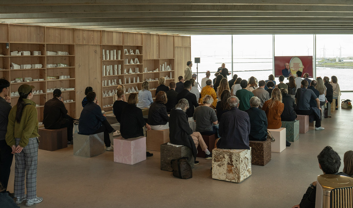 Talk by Carlotta de Bevilacqua and Jakob Lange during 3daysofdesign with audience seated on cubes of different materials in a modern exhibition space.
