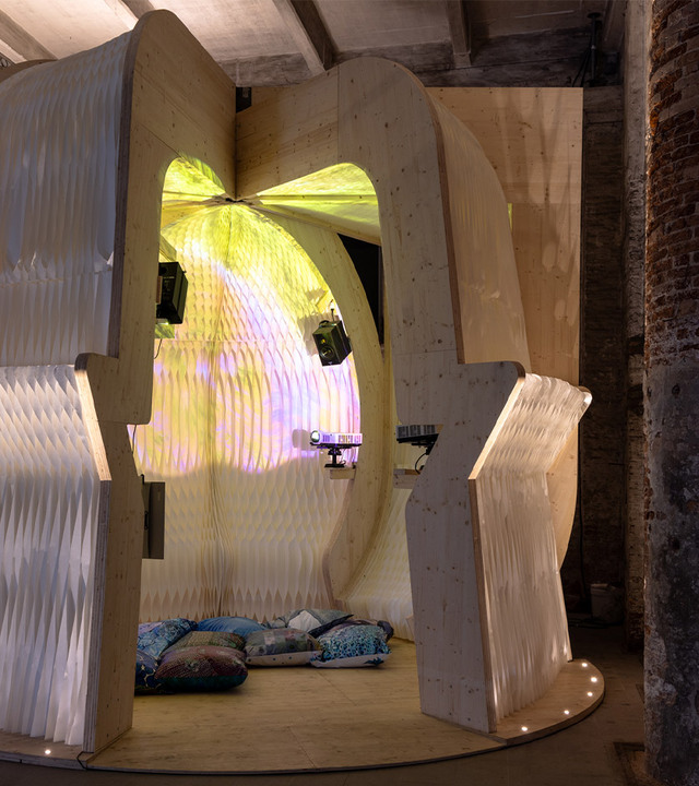 Art installation made of paper and wood inspired by the theme of water.