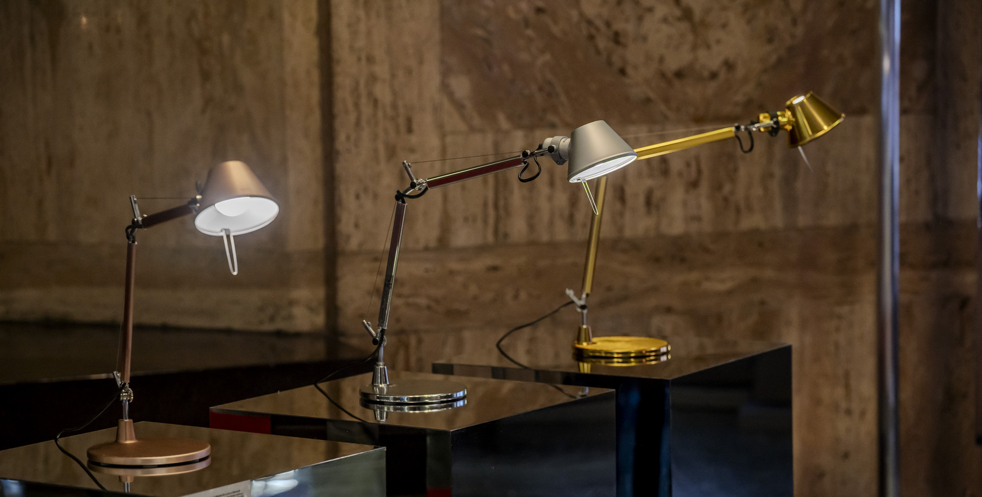 Image of three Tolomeo Micro Table displayed at the exhibition.