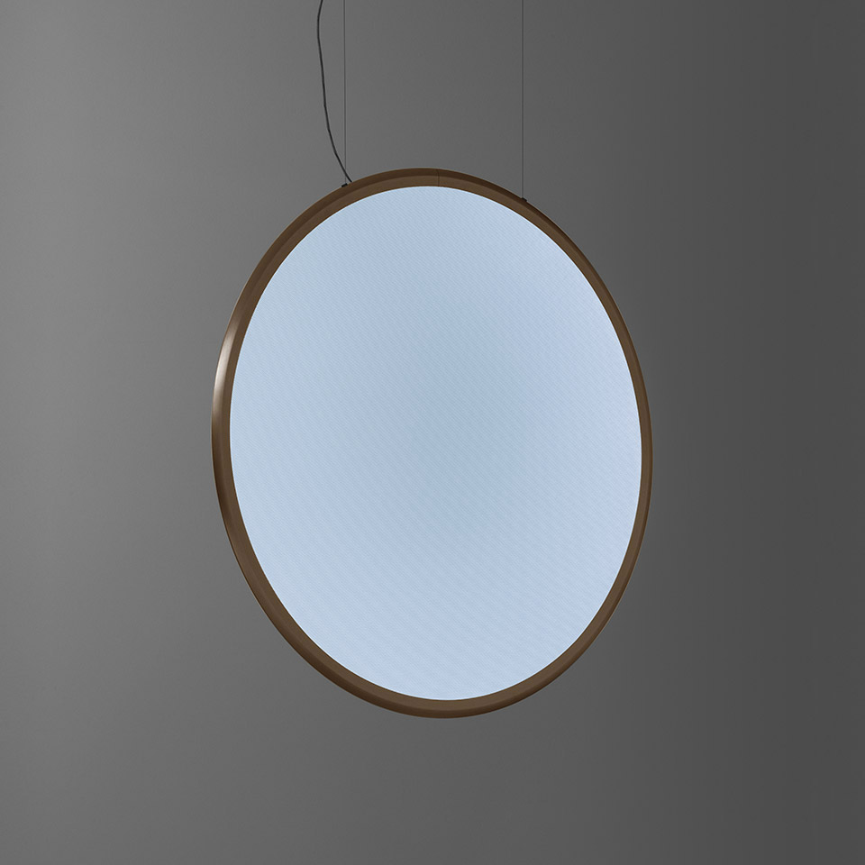 Artemide Discovery pendant lamp: large circular diffuser with warm bronze frame emitting soft, uniform white light, suspended by thin cables
