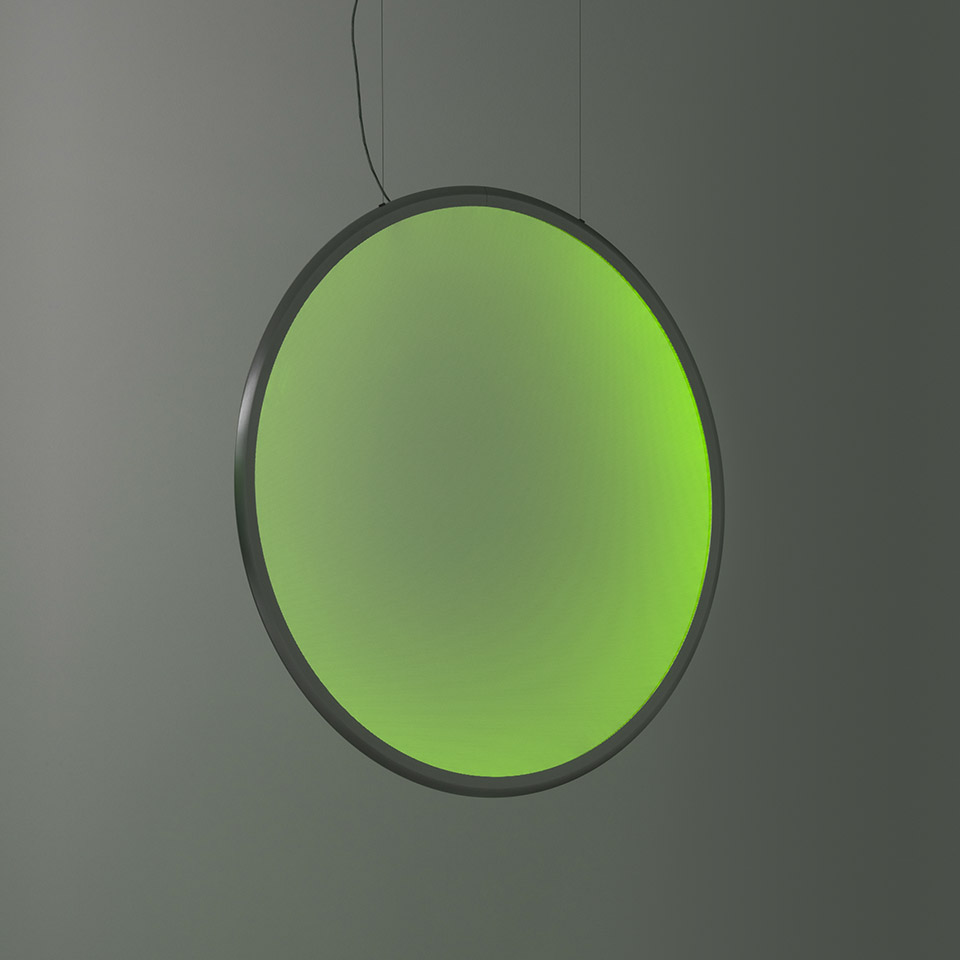 Artemide Discovery pendant lamp: large circular disc emitting vibrant green light, dark metal frame, suspended by thin cable