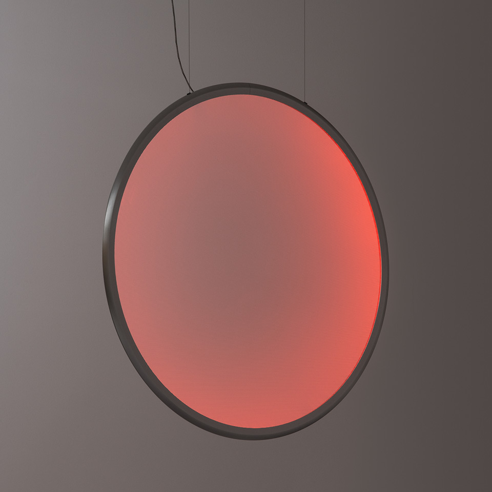 Artemide Discovery pendant lamp: large circular diffuser emitting warm red light, dark metal frame, suspended by a thin cable - 2