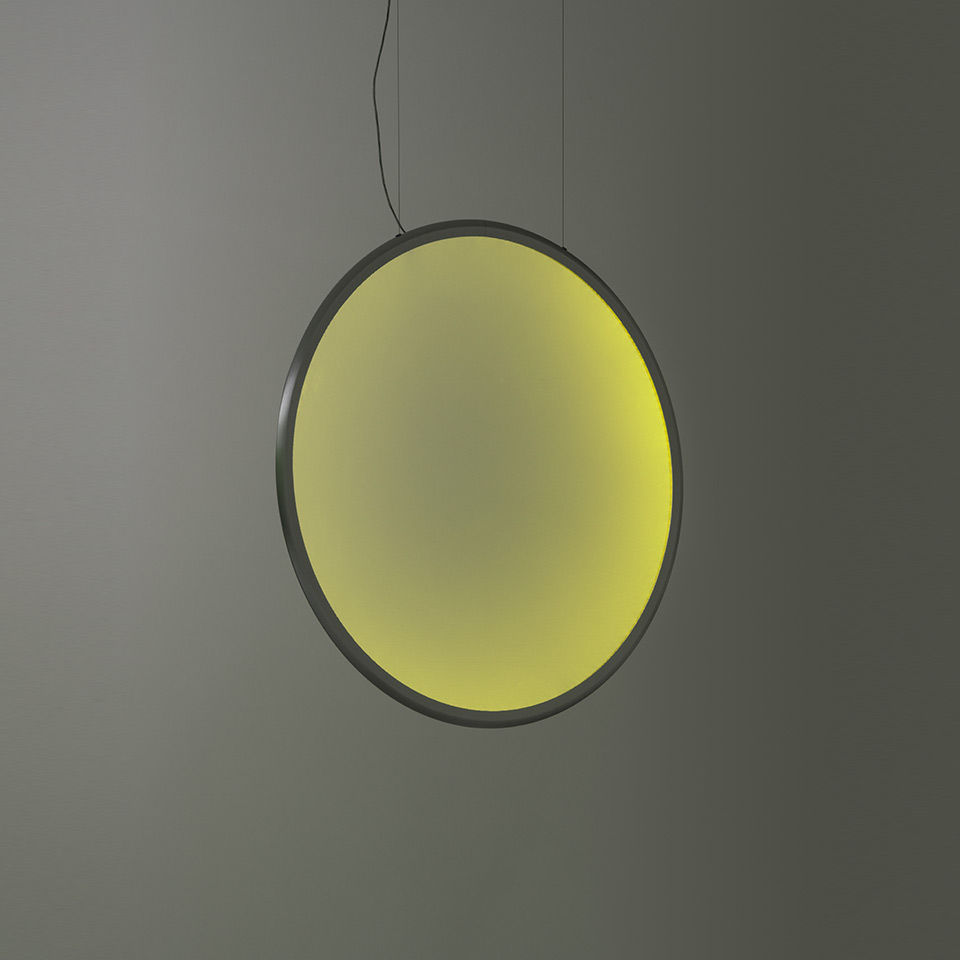 Artemide Discovery pendant lamp: large circular disc emitting soft yellow-green gradient light, dark metal frame, suspended by black cable - 2