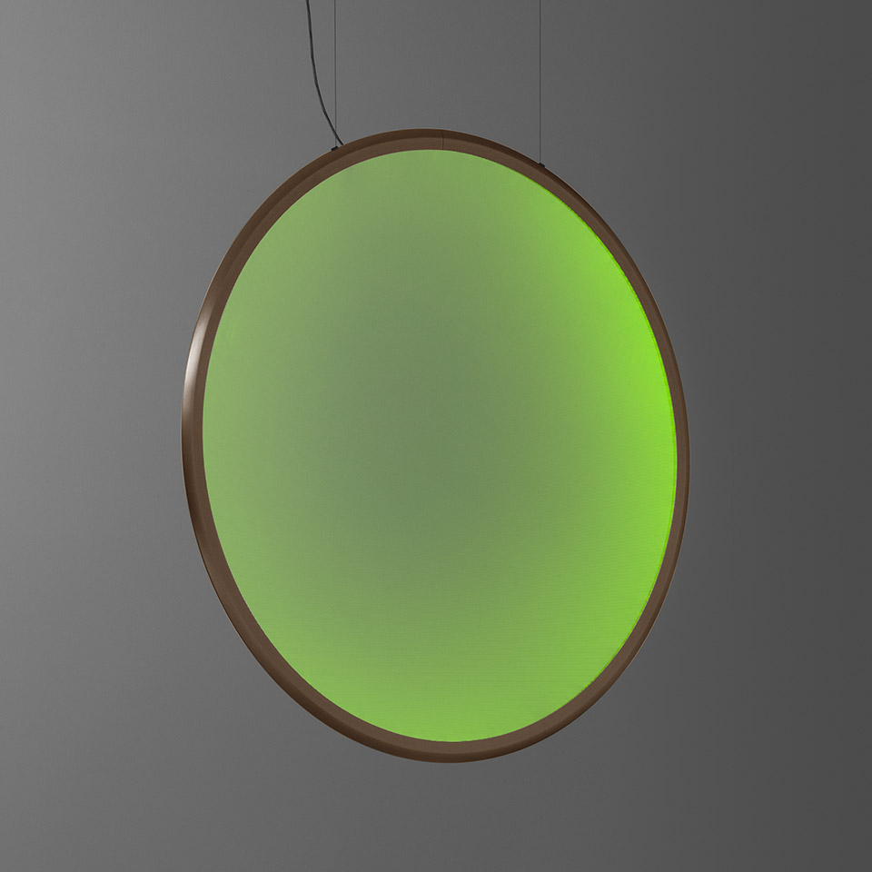 Artemide Discovery pendant lamp: large circular disc with bronze frame emitting vibrant green light, suspended by thin cables