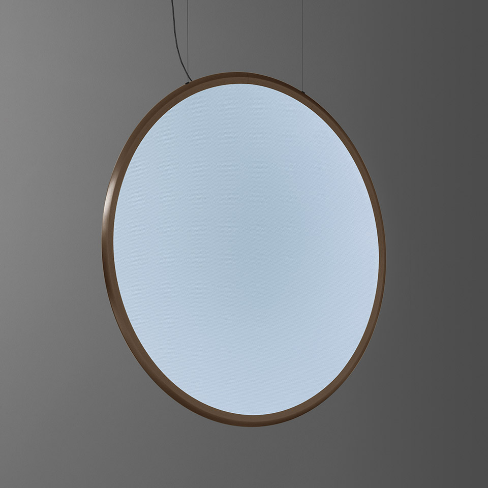Artemide Discovery pendant lamp: large circular diffuser with soft blue-white light enclosed in a thin bronze metal ring, suspended by cables