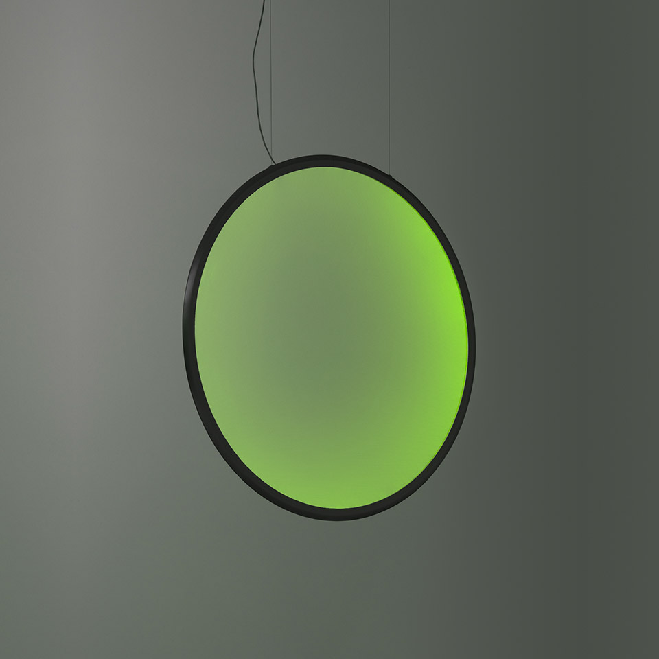 Artemide Discovery pendant lamp: large circular disc with black frame emitting vibrant green light, suspended by a thin black cable