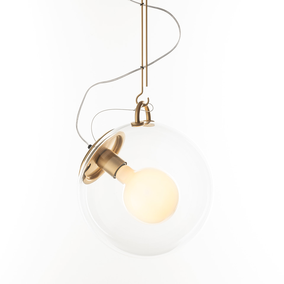 Artemide Miconos pendant lamp: clear glass sphere enclosing a frosted bulb, brass hardware and hook, with looped suspension cable