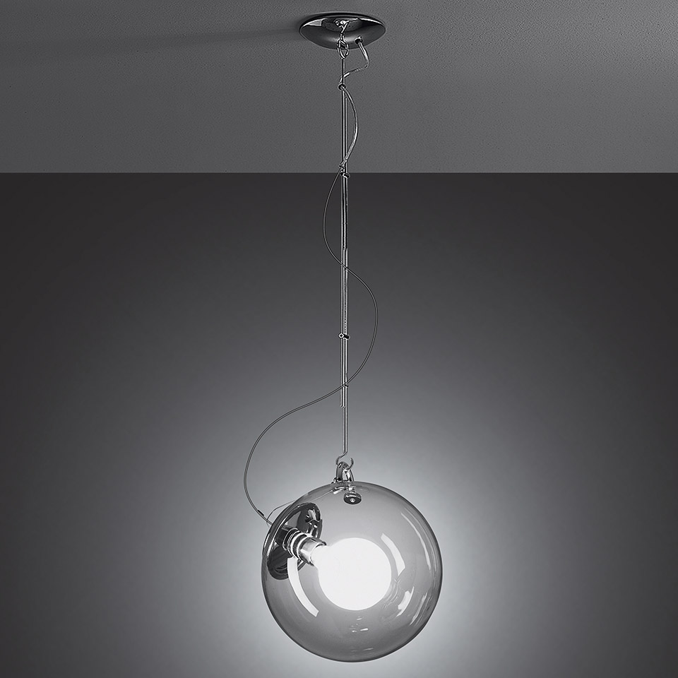 Artemide Miconos pendant lamp: transparent glass sphere with chrome fitting and bulb, suspended by a thin chrome chain from ceiling