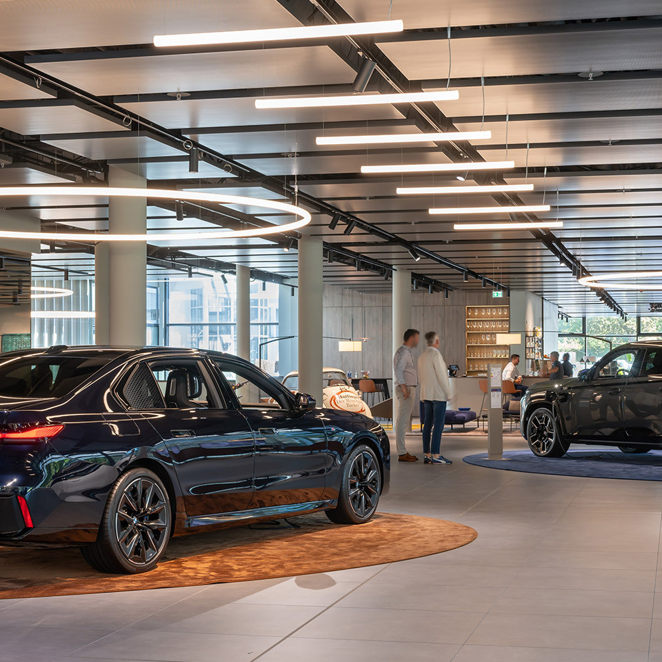Image of the interior of the BMW branch illuminated by Alphabet of Light Circular and Linear.