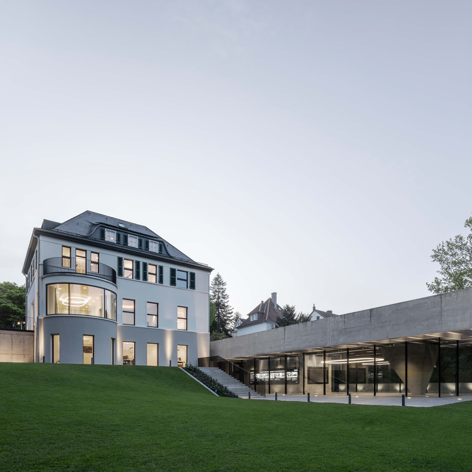 Image of the exterior of the villa showing Alphabet of Light in the main rooms.