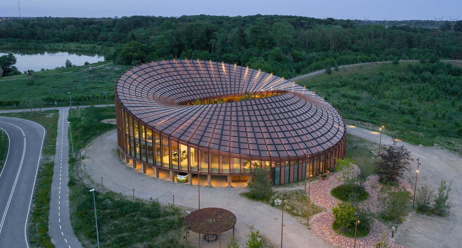 Aerial view of the BIG-designed building illuminated with Stellar Nebula pendants.