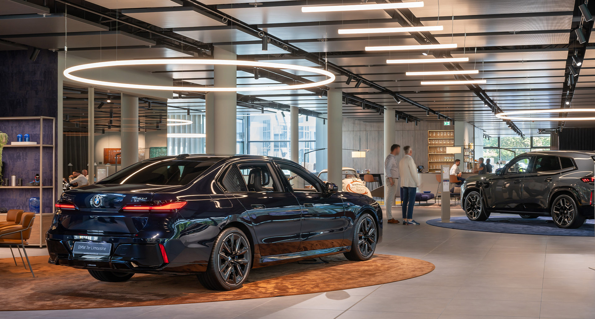 Image of the interior of the BMW branch illuminated by Alphabet of Light Circular and Linear.