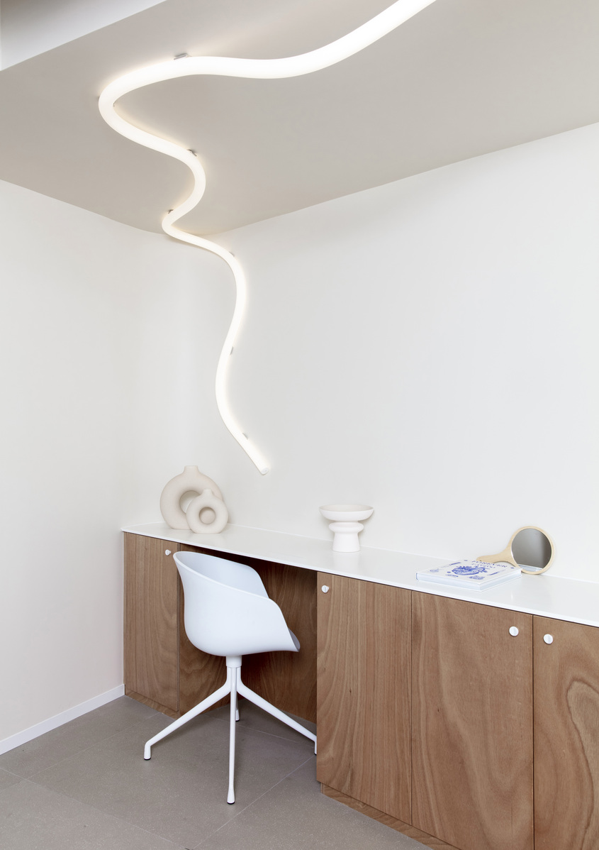 Image of the studio room lit with La Linea running from the ceiling to the wall.