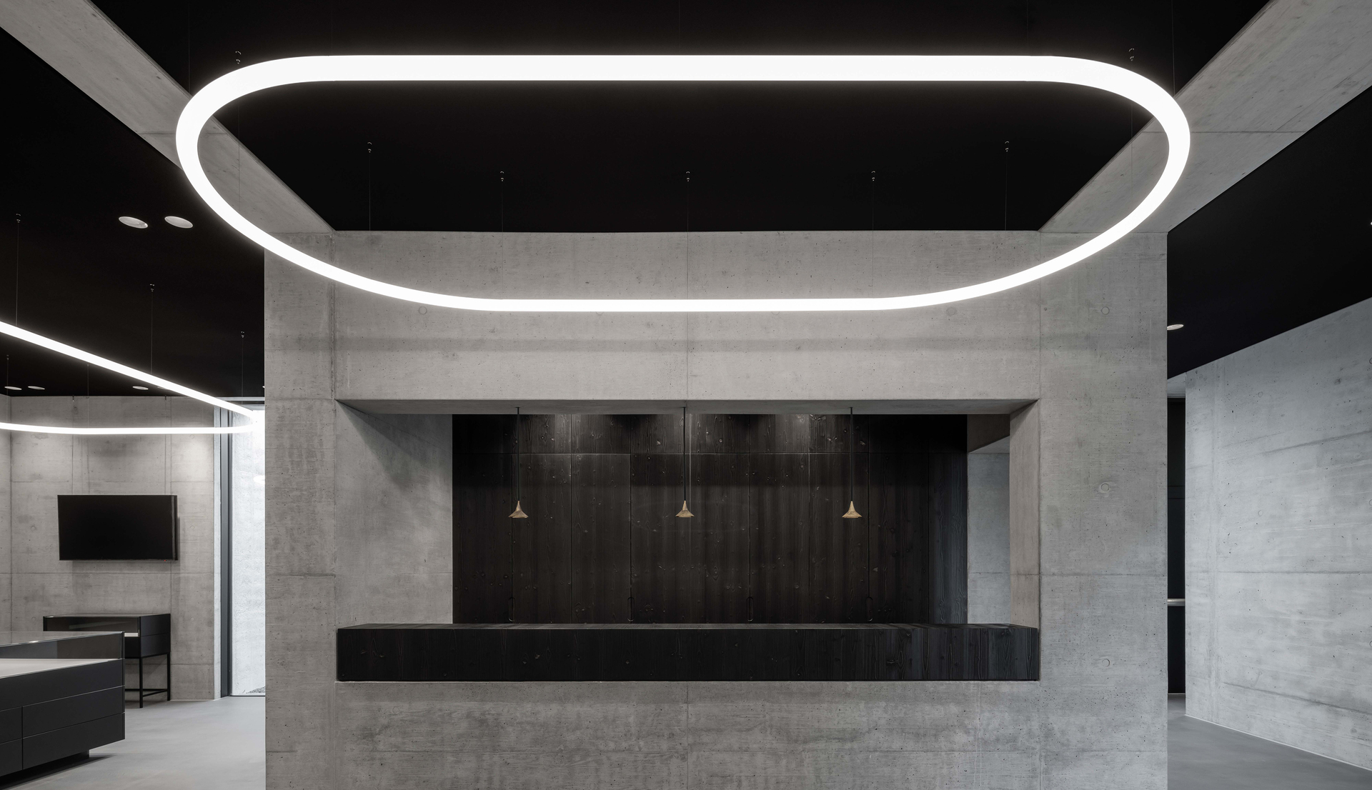 Image of a reception area illuminated by Alphabet of Light System and Unterlinden Suspension.