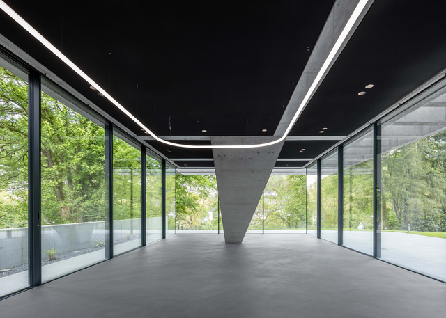 Image of a large space with all the windows lit by Alphabet of Light System.