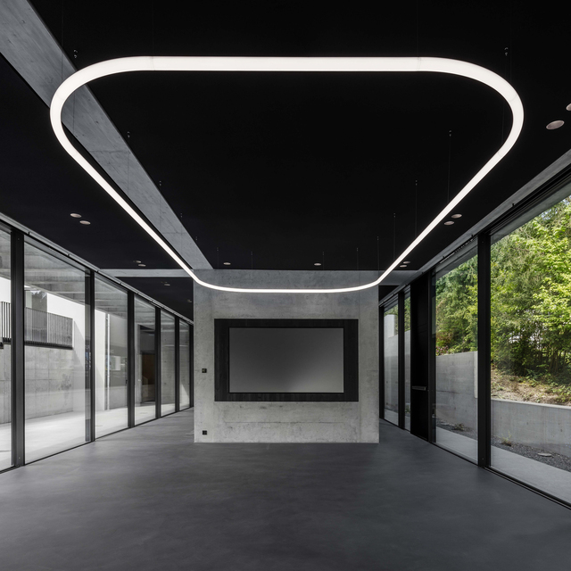 Image of a large space with all the windows lit by Alphabet of Light System.