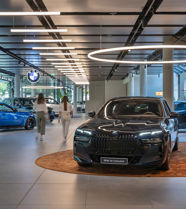 Car inside the BMW branch, illuminated by Alphabet of Light Suspension Circular.