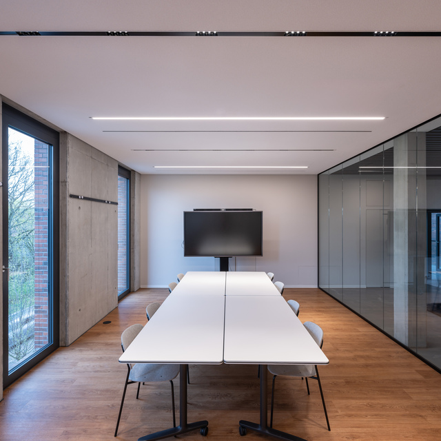 Image of a meeting table illuminated by A.24.