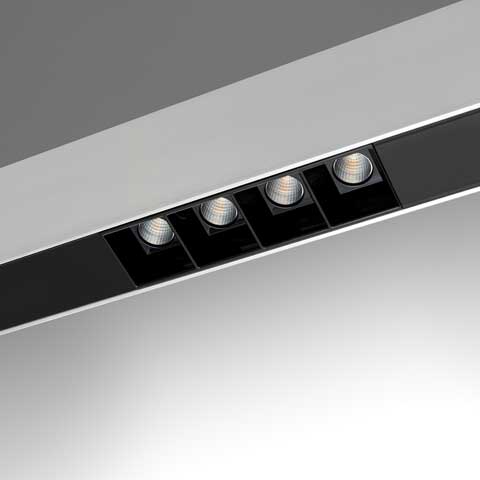 Artemide A. Sharping recessed ceiling light strip with four adjustable black LED spotlights set in a slim white linear profile