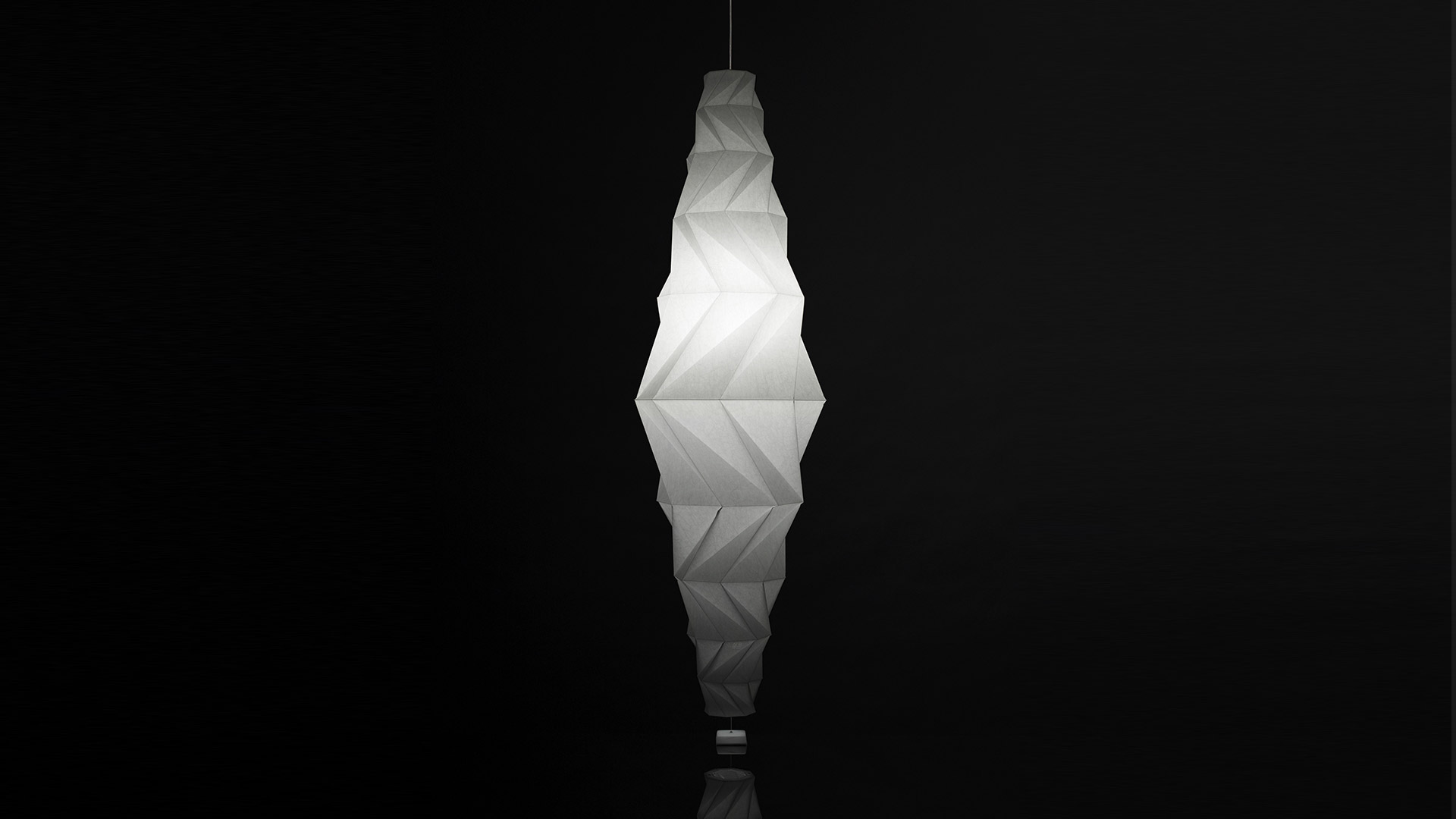 Artemide In-Ei Issey Miyake Minomushi pendant lamp: elongated diamond-shaped diffuser with geometric folded white fabric, glowing softly