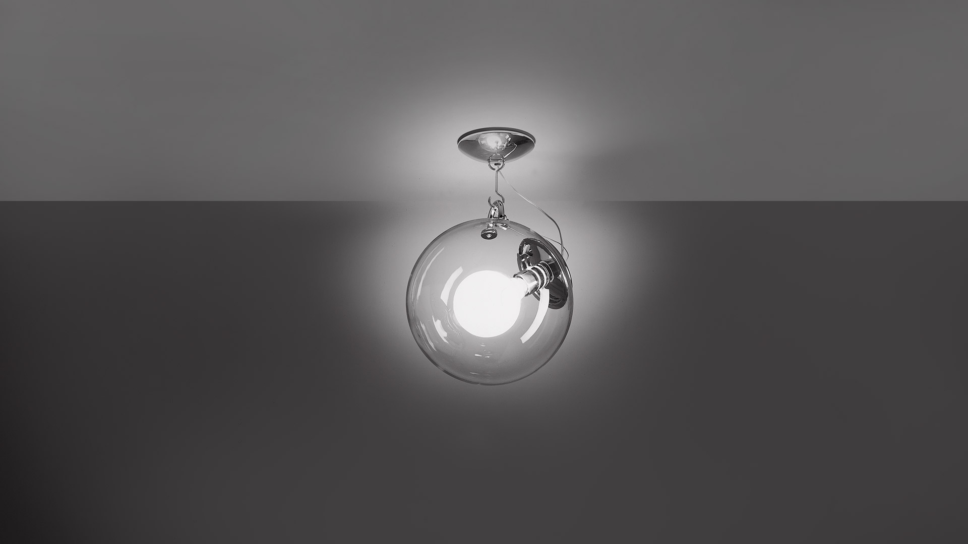 Artemide Miconos ceiling lamp: transparent glass sphere with inner opal globe, chrome hardware, mounted flush to ceiling